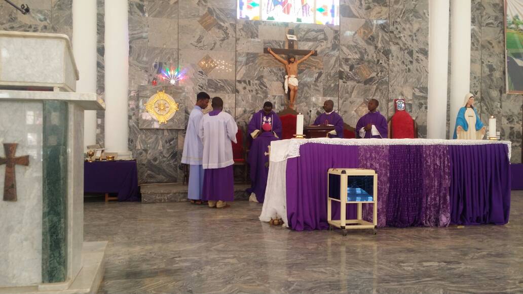 Bishop receiving ashes 