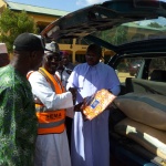 Fr. Lawrence presenting items to SEMA